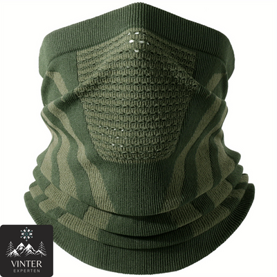 Grön vinter halsduk från Vinterexperten, designad med ventilerande material och ergonomisk passform för värme och komfort under kalla dagar.